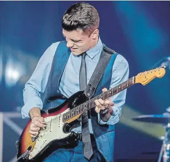  ?? SPECIAL TO THE NIAGARA FALLS REVIEW ?? Beamsville’s Riley Michaels, 18, takes the stage at Guitar Wars in Thorold Feb. 1 along with David Gogo, Paul DesLaurier­s, J.W. Jones and Steve Grisbrook.