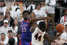  ?? BRAD TOLLEFSON — THE ASSOCIATED PRESS ?? Kansas’ Udoka Azubuike (35) blocks a shot by Texas Tech’s Chris Clarke (44) during the first half of an NCAA college basketball game Saturday, March 7, 2020, in Lubbock, Texas.