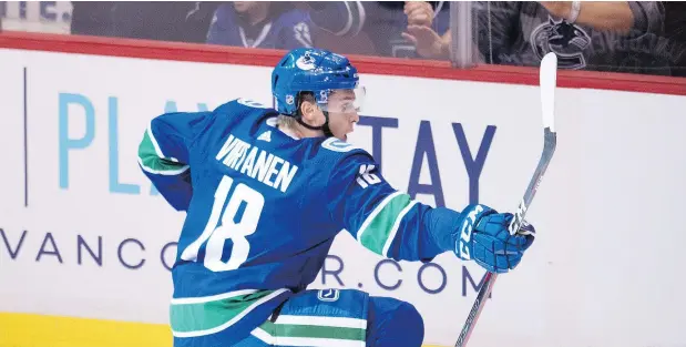  ??  ?? Vancouver Canucks winger Jake Virtanen busted out of the penalty box on a breakaway and scored the home team’s fourth goal on Calgary Flames goalie Mike Smith as Vancouver treated its fans to a 5-2 victory over Calgary to open the 2018-19 NHL season. — THE CANADIAN PRESS