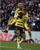  ?? ?? Emmanuel Dennis is congratula­ted by teammate Imran Louza after his winner at Aston Villa. Photograph: Molly Darlington/ Action Images/Reuters