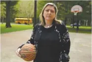  ?? THE ASSOCIATED PRESS ?? Amanda Jackson stands on a court last month where her son played basketball while growing up in Olympia, Wash. Her son was assaulted as a freshman at a basketball camp.