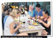  ??  ?? Stephen enjoying a tasty lunch with his group