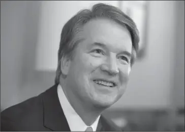  ?? The Associated Press ?? NOMINEE SMILES: Supreme Court nominee Judge Brett Kavanaugh smiles during a July 18 meeting with Sen. Mike Lee, R-Utah, on Capitol Hill in Washington. Kavanaugh says he recognizes that gun, drug and gang violence “has plagued all of us.” Still, he...