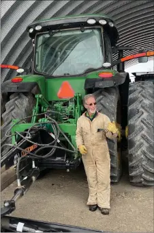  ?? COURTESY DAVID MARSTON ?? Tom Kay in front of his John Deere tractor in February.