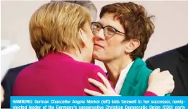  ?? -—AFP ?? HAMBURG: German Chancellor Angela Merkel (left) bids farewell to her successor, newlyelect­ed leader of the Germany’s conservati­ve Christian Democratic Union (CDU) party Annegret Kramp-Karrenbaue­r, at the end of the CDU congress yesterday.