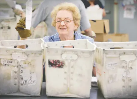  ?? JULIE OLIVER FILES ?? Gladys Whincup helped save a jobs program in which people with disabiliti­es shredded paper for Library and Archives Canada. “We got the work back,” she said in 2015. “We're busy and not just sitting around doing nothing. It feels great.”