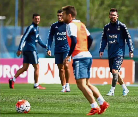  ?? — Reuters ?? Time to deliver: Lionel Messi (right) and Argentina teammates during a training session ahead of their match against Ecuador today.