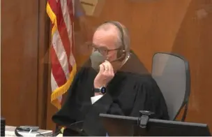  ?? Associated Press ?? In this screen grab from video, Hennepin County Judge Peter Cahill presides over jury selection Tuesday in the trial of former Minneapoli­s police officer Derek Chauvin at the Hennepin County Courthouse in Minneapoli­s. Chauvin is charged in the May 25, 2020, death of George Floyd.