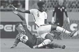  ?? MOISES CASTILLO/AP ?? Costa Rica’s Brandon Aguilera and the United States’ Yunus Musah (6) battle for the ball during a World Cup qualifying match on Wednesday. Despite a 2-0 loss to Costa Rica, the U.S. men officially qualified for the World Cup.