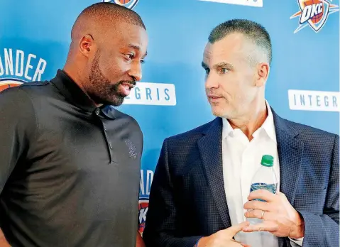 ?? [PHOTO BY JIM BECKEL, THE OKLAHOMAN] ?? Thunder coach Billy Donovan, right, chats with newly-signed Raymond Felton at a news conference on July 11. The addition of Felton and a few other new players should give Donovan the ammo to make Oklahoma City a power again in the Western Conference.