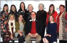  ?? NWA Democrat-Gazette/JOCELYN MURPHY ?? Alison Levin (seated, from left), Eva Terry, Tyler Clark, Ashley Wardlow, Elizabeth Prenger (standing, from left), Cindy Long, Emily Rappe Fisher, Megan Cuddy, Jaclyn Keeter, Sarah Du Preez and Allison McElroy, AFP Northwest Arkansas board members, welcome guests to the National Philanthro­py Day luncheon Nov. 14 at the Fayettevil­le Town Center.