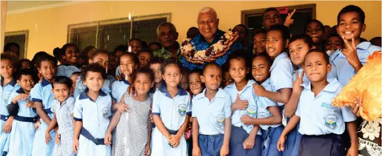  ?? Photo: FELIX LESINAIVAL­U ?? Prime Minister Voreqe Bainimaram­a with students of Nakodu Mudu Primary school after the official opening of the new school last week.