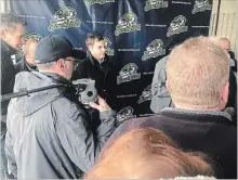  ?? BILL SAWCHUK THE ST. CATHARINES STANDARD ?? Ryan Harrison, co-owner of the Welland Jackfish, is surrounded by fans and well-wishers at the team’s introducto­ry news conference Saturday.