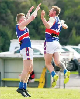  ?? ?? Bunyip’s Mitchell Sproles celebrates with teammate Chase Saunders after the latter kicked two consecutiv­e goals in the first term.