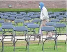  ?? MIKE DE SISTI/USA TODAY NETWORK ?? The Milwaukee COVID-19 Memorial consists of nearly 600 empty chairs to represent lives lost to COVID-19.
