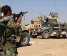  ?? EPA ?? An Afghan soldier takes aim during an offensive against Taliban militants as the military recaptured some of the districts in Nade-Ali area from the extremists in Helmand this week