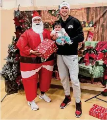  ?? Liberty Swift/san Antonio Spurs ?? Spurs forward Doug Mcdermott helped distribute 120 decorated Christmas trees Tuesday at a West Side giveaway.