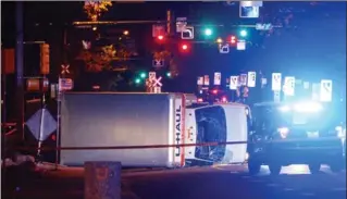  ?? JASON FRANSON, THE ASSOCIATED PRESS ?? A truck rests on its side after a high-speed chase with police in Edmonton on Saturday.