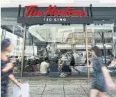  ?? NATHAN DENETTE THE CANADIAN PRESS FILE PHOTO ?? Restaurant­s Brands Internatio­nal, owner of Tim Hortons and other brands, said it is starting to move past comparing traffic with pre-pandemic levels.