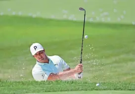  ?? DARRON CUMMINGS/AP ?? Bryson Dechambeau hits from the bunker in the practice area during a practice round for the Memorial golf tournament Wednesday in Dublin, Ohio.