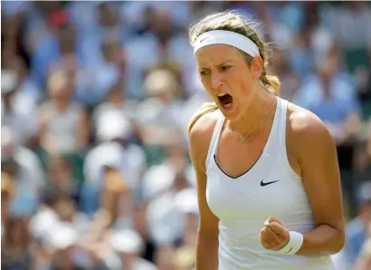  ??  ?? Victoria Azarenka celebrates a point during her third round match against Heather Watson on Friday. —