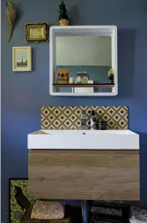  ??  ?? ABOVE & RIGHT Sadie’s bathroom is painted in Farrow & Ball’s Oval Room Blue and the reclaimed shutters came from Design Vintage. Find similar tiles at Bert & May.