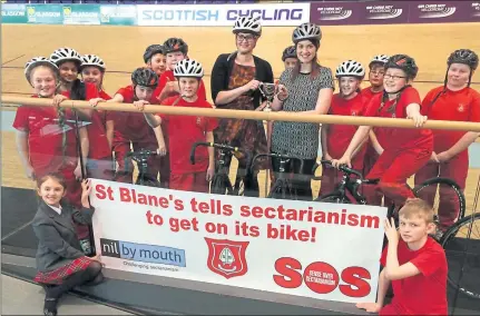  ??  ?? Pupils at St Blane’s Primary help Cara Henderson, centre, launch the anti-bigotry campaign which will see teams of volunteers cycle around all of Glasgow’s football grounds to spread the anti-hate message a month before the Old Firm meet at Parkhead