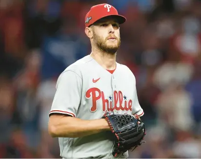  ?? ELSA/GETTY IMAGES ?? Phillies starter Zack Wheeler was cruising Monday night before giving up a two-run homer to Travis d’Arnaud and getting pulled in the seventh inning of a 5-4 loss to the Braves in Game 2 of the NL Division Series.