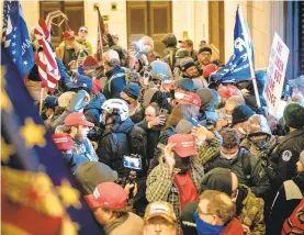  ?? FILE ?? Supporters of President Donald Trump swarm inside the Capitol building in Washington on Jan. 6.