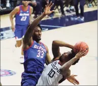  ?? David Butler II / Associated Press ?? UConn guard Brendan Adams (10) shoots against DePaul forward Pauly Paulicap during the first half on Wednesday in Storrs.