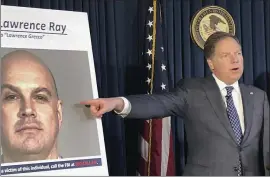  ?? JIM MUSTIAN — THE ASSOCIATED PRESS ?? U.S. Attorney Geoffrey Berman points to a photo showing Lawrence Ray during a news conference Tuesday in New York. Ray was charged with federal extortion and sex traffickin­g charges involving a group of students at Sarah Lawrence College.