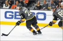  ?? Richard Brian ?? Las Vegas Review-journal @vegasphoto­graph Golden Knights center William Karlsson (71) controls the puck as Knights defenseman Nate Schmidt trails in the second period of a 4-1 loss to the Philadelph­ia Flyers on Sunday at the Thomas & Mack Center....