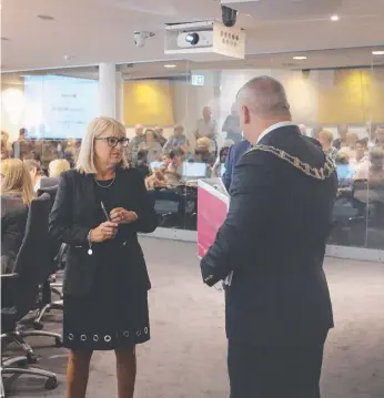  ?? Picture: GLENN HAMPSON ?? Members of the public sit behind a glass wall at Evandale as Deputy Mayor Donna Gates and Mayor Tom Tate prepare to get a council meeting underway.