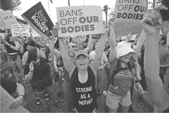  ?? ?? Protesters chant during a rally at the Arizona Capitol in favor of keeping abortion legal. A leaked opinion from the U.S. Supreme Court appeared to show the court was favoring overturnin­g landmark Roe v. Wade.