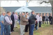  ?? Jeremy Stewart ?? Attendees stand on the front lawn of the Rockmart municipal complex, which was formerly the campus of Rockmart High School, during the ceremony renaming the complex for former city manager Jeff Ellis in April, 2022.