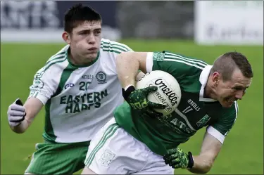  ??  ?? Adrian Marren of Curry is tackled by Conor Scanlon of Eastern Harps in Tubbercury. Pic: Tom Callanan.