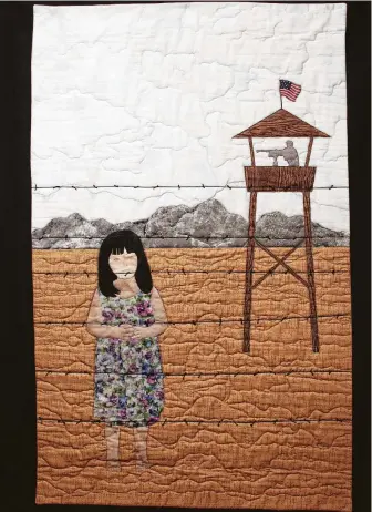  ?? Internatio­nal Quilt Festival photos ?? “Don’t Fence Me In,” representi­ng a barbed-wire fence at the U.S.-Mexico border with an armed sentry positioned nearby, will be part of the OURstory: Human Rights Stories in Fabric exhibit at the 2018 Internatio­nal Quilt Festival.