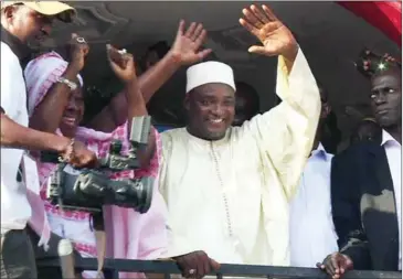  ?? JOE SINCLAIR/AFPTV ?? This video grab taken from footage shot by AFPTV shows Adama Barrow (centre), Gambia’s president-elect, gesturing to the crowd in Kololi on Friday following his victory in the polls.