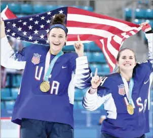  ?? JUNG YEON-JE/AFP ?? USA’s Megan Keller (left) celebrates with teammate Danielle Cameranesi after winning the women’s ice hockey at the Pyeongchan­g 2018 Winter Olympics yesterday.