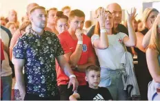  ?? Antonin Kélian Kallouche/Gulf News ?? England supporters react during the semi-final against Croatia at the Atlantis World Cup Fan Zone in Dubai.