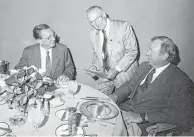  ??  ?? Bermann attends to longtime customers Wayne Duddlesten, left, and Harvey Houck.