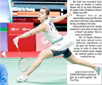  ??  ?? AGENCE FRANCE-PRESSE CAROLINA Marin refuses to give up a point against Tai Tzu-Ying.