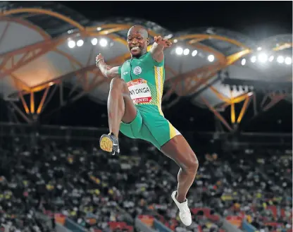 ?? /Roger Sedres/Gallo Images ?? Leap of faith: Luvo Manyonga snatched the gold medal from Australia’s Henry Frayne in the long jump on Wednesday. Ruswahl Samaai won a bronze.