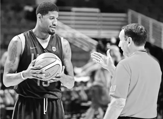  ?? DAVID BANKS, USA TODAY SPORTS ?? Paul George, left, with Team USA coach Mike Krzyzewski, set a career high with 23.1 points a game for the Pacers last season.