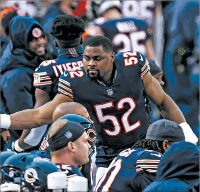  ?? ARMANDO L. SANCHEZ/CHICAGO TRIBUNE ?? Bears outside linebacker Khalil Mack reaches for his helmet before last Sunday’s game against the Packers at Soldier Field.