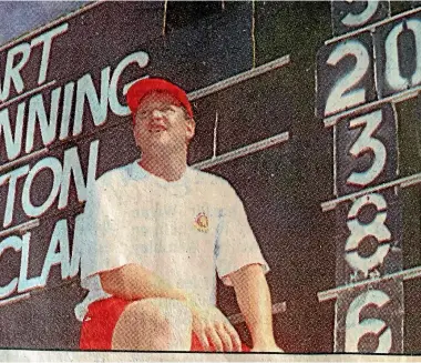  ?? STUFF ?? The Manawatu¯ Standard newspaper clipping of Dave Fulton proudly posing beside the scoreboard showing his double-century in 1994.