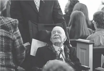  ?? ALEX BRANDON/AP ?? Former President Jimmy Carter greets people as he leaves after the funeral service for his wife, former first lady Rosalynn Carter, at Maranatha Baptist Church on Nov. 29 in Plains, Ga. The former first lady died on Nov. 19. She was 96.