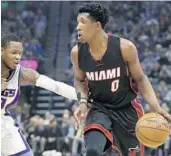  ?? RICH PEDRONCELL­I/AP ?? Miami’s Josh Richardson missed Sunday’s game, but an MRI showed his injured foot to be only a sprain.