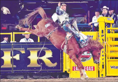  ?? Dan Hubbell
PRCA ?? After a rodeo accident in 2018 in Texas left him with a broken back, walking on his own has been and remains the goal for J.R. Vezain, seen competing in Round 10 of the 2017 Wrangler National Finals Rodeo. With the use of robotic legs, Vezain has taken more than 100,000 assisted steps in about a year.