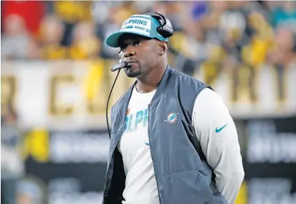  ?? DON WRIGHT/AP ?? Dolphins coach Brian Flores stands on the sidelines during Miami’s game against the Steelers on Oct. 28.